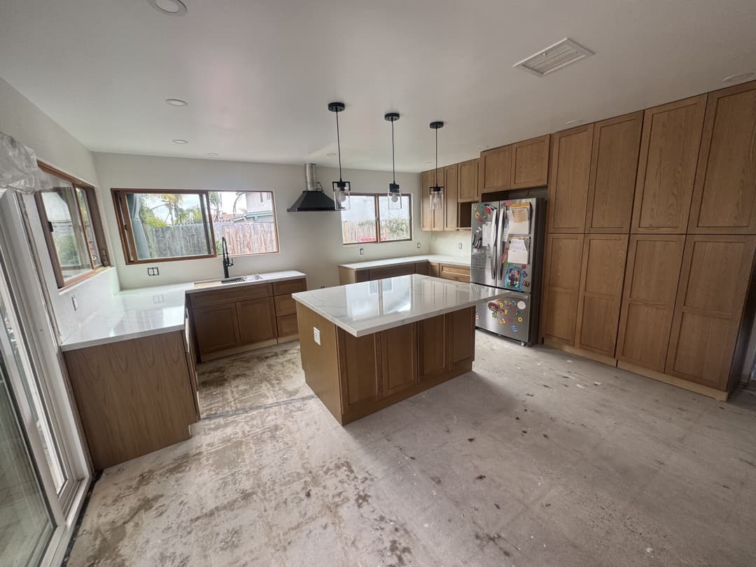 Modern kitchen renovation featuring custom cabinetry and updated countertops