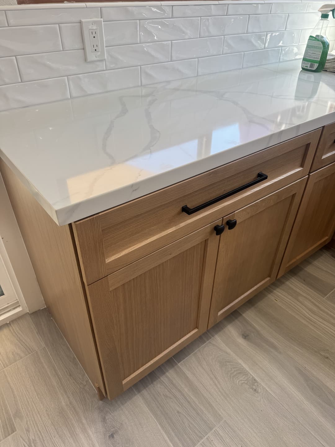 Custom kitchen cabinetry and hardware installed during full home renovation